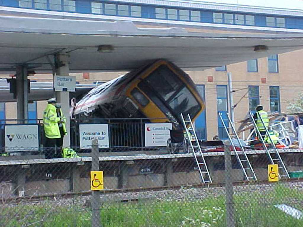 Crashed train on railway platform in the UK