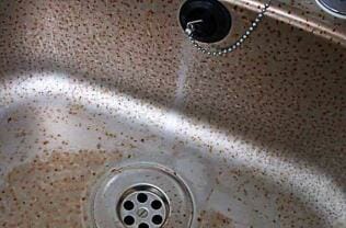 Corrosion of a stainless steel sink.