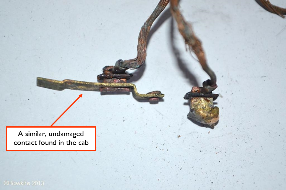 Photograph 1: One of the damaged switch contacts and an undamaged exemplar from the incident vehicle