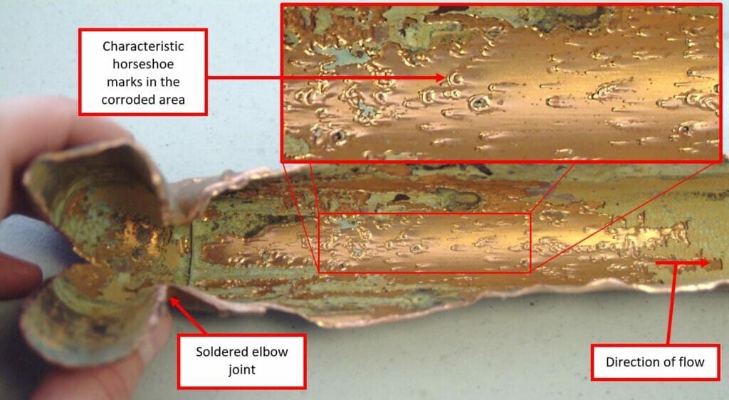 Corroded internal surface showing pit marks on a failed section of the return pipe