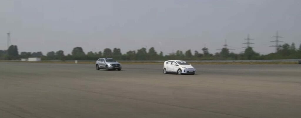testing breaking distances: Two cars demonstrating breaking distances