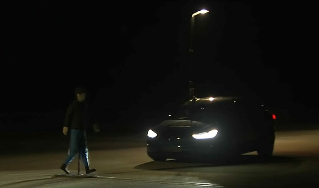 Testing breaks at night: with a pedestrian walking in-front of a car at night, testing the breaking