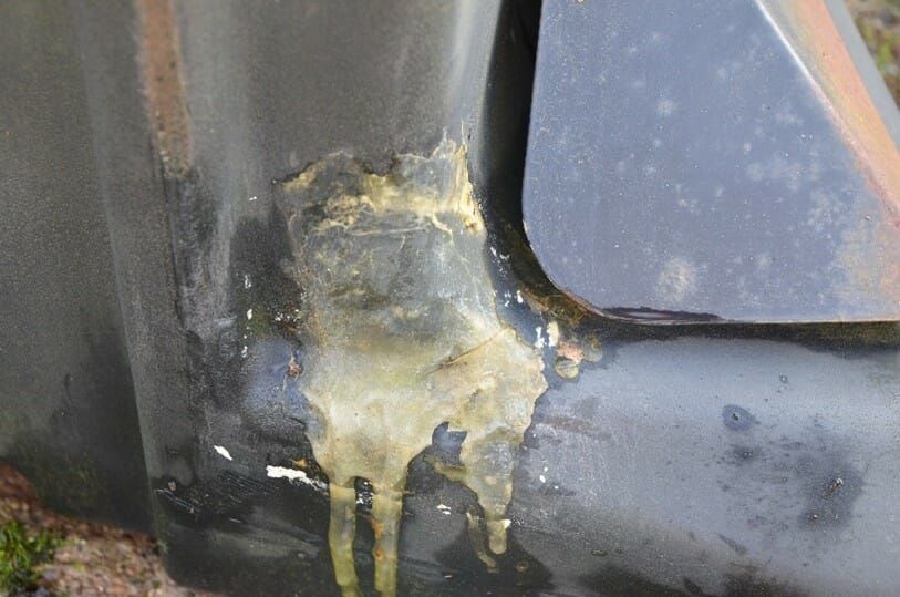 An adhesive used unsuccessfully for a fuel tank patch repair