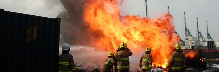 Fire fighters and shipping container fire