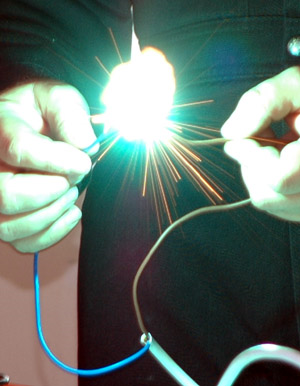 The author demonstrating electrical arcing between live conductors.