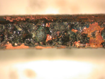 A close-up of a section of Figure 8 showing the arcing through carbonised cable insulation in more detail.