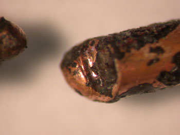 A severed conductor with a ”bull-nose” bead. The demarcation between the melted and un-melted conductor is visible.