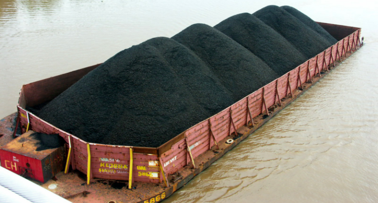 open topped transporter cargo ship filled with coal