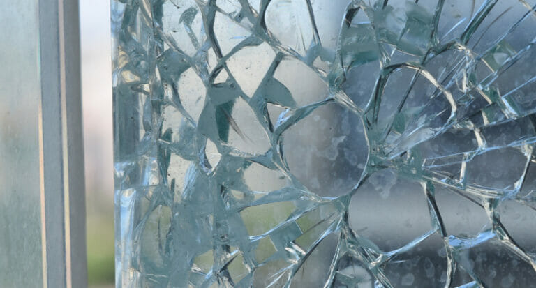 image of shattered glass and a glass inclusion