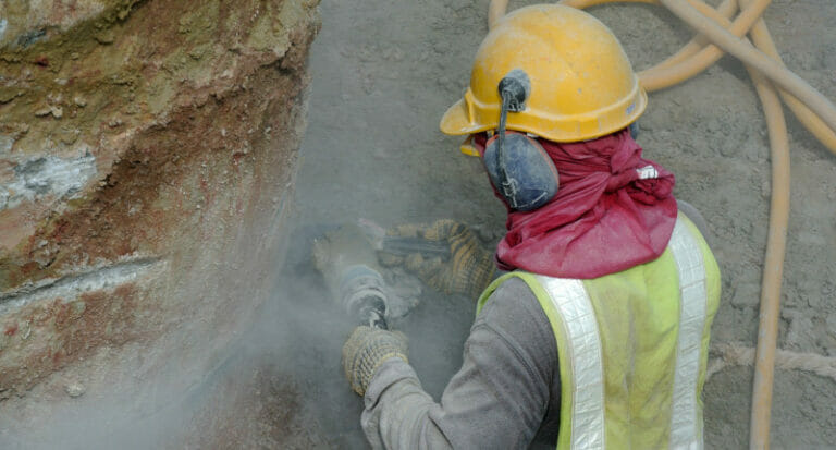 Man with ear protection on building site