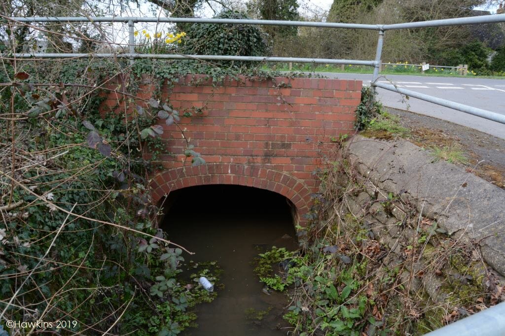 Bridge and a stream/river which later burst its banks and flooded a property