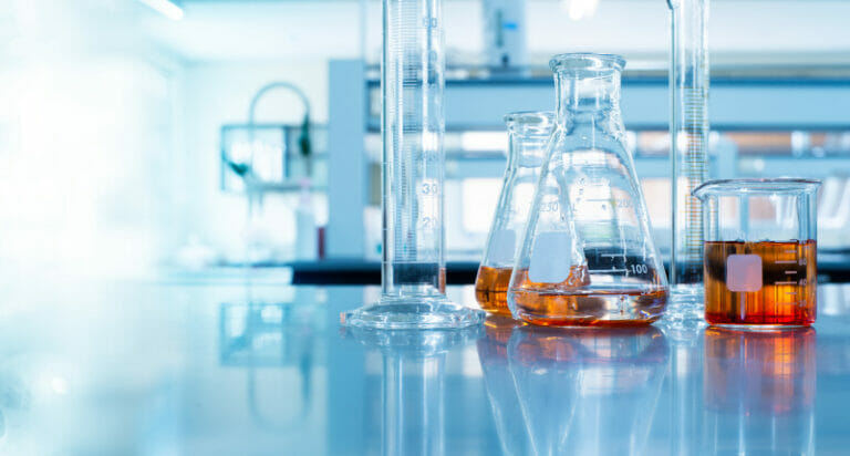beaker and flask in science university laboratory with chemical structure blue banner background
