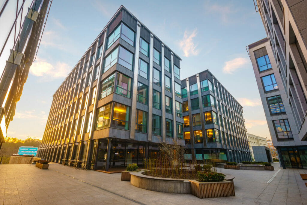 Image of a modern office block taken as the sun is setting