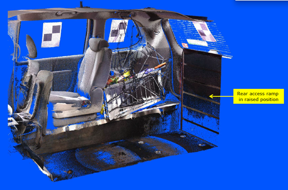 A laser scan model of the interior of the rear of the WAV without the wheelchair onboard. The picture has an arrow pointing to the rear access ramp in a raised position.