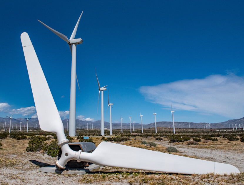 Broken wind turbine blades laying on the ground