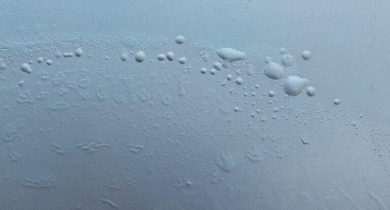 close up blistering paint on car