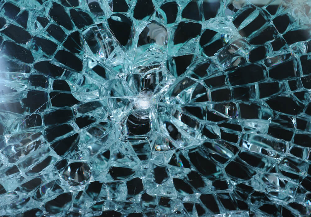Shattered glass with impact point