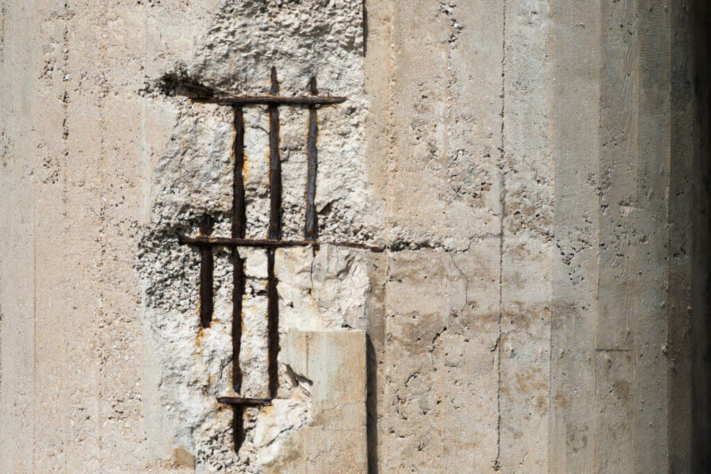 spalling of concrete exposed after corrosion on wall