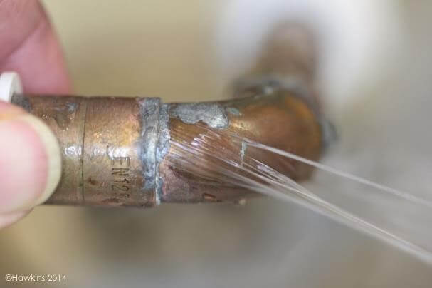 Escape of water from copper pipe