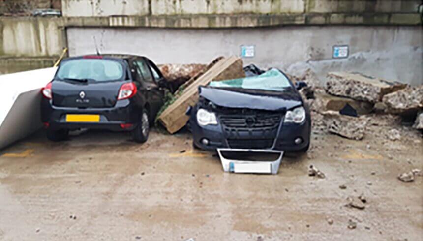 Rubble collapsed onto 2 cars