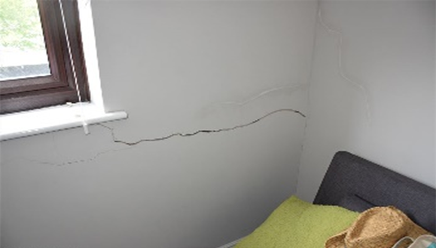 Crack in the wall of a bedroom