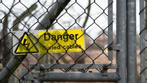 Danger keep out sign on a fence