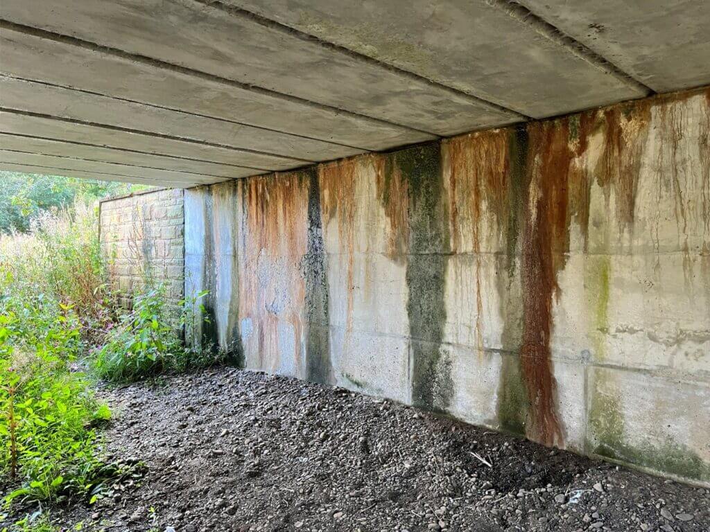 concrete spalling from long term water damage