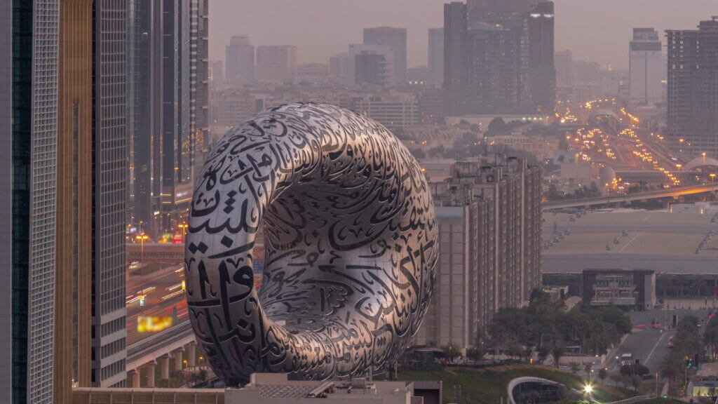 Museum of the Future exhibition space aerial night to day timelapse with iconic torus shape