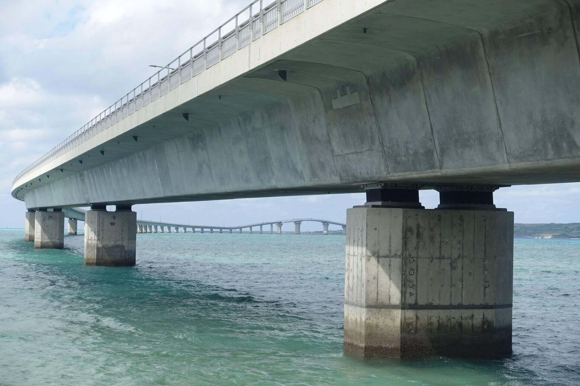 close up of Irabu bridge lower view from Miyako-island shore towards Irabu-island
